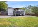 Spacious backyard featuring a deck, patio and ample green space for recreation at 1251 Pierce Se Ave, Smyrna, GA 30080