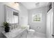 Bathroom with gray vanity, granite countertops, walk in shower and window at 1251 Pierce Se Ave, Smyrna, GA 30080