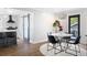 Dining area adjacent to kitchen features modern light fixture and sliding doors to exterior at 1251 Pierce Se Ave, Smyrna, GA 30080