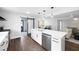 Kitchen with a large island, pendant lighting, and stainless steel appliances at 1251 Pierce Se Ave, Smyrna, GA 30080