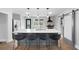 Kitchen with a large island, pendant lighting, stainless appliances, and stylish bar stools at 1251 Pierce Se Ave, Smyrna, GA 30080
