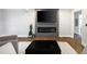A living room with a modern fireplace, wooden floors, and a large television at 1251 Pierce Se Ave, Smyrna, GA 30080