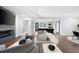 Bright, open living room with hardwood floors, fireplace, and seamless access to the kitchen at 1251 Pierce Se Ave, Smyrna, GA 30080