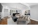 Bright open-concept living space with hardwood flooring connecting the living room and kitchen at 1251 Pierce Se Ave, Smyrna, GA 30080