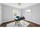 Bright home office with a large black desk and two windows at 1251 Pierce Se Ave, Smyrna, GA 30080