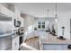 Bright kitchen features an island with granite countertops, stainless steel appliances, and modern pendant lighting at 300 Oldvine Dr, Lawrenceville, GA 30044