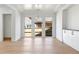 Spacious dining area with modern lighting and hardwood floors at 504 Barrington Dr, Roswell, GA 30075