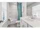 Bright bathroom features a shower-tub combo with modern fixtures and stylish blue curtain at 524 Provence Gate Ln, Lawrenceville, GA 30044