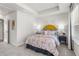 Charming bedroom features a tray ceiling, stylish decor, and a comfortable bed at 524 Provence Gate Ln, Lawrenceville, GA 30044