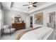 Well-lit bedroom with a decorative dresser, a chair and a large art piece on the wall at 524 Provence Gate Ln, Lawrenceville, GA 30044