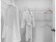 Functional closet space with wire shelving and hanging white robes, maximizing storage at 524 Provence Gate Ln, Lawrenceville, GA 30044