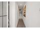 Bright hallway features hardwood floors, white walls, and leads to staircase at 524 Provence Gate Ln, Lawrenceville, GA 30044