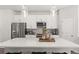 Close-up of kitchen island featuring quartz counters, pendant lighting, and stainless steel appliances at 524 Provence Gate Ln, Lawrenceville, GA 30044
