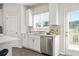 Kitchen area features stainless steel appliances, sink with a view, and lots of natural light at 524 Provence Gate Ln, Lawrenceville, GA 30044