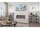 Well-lit living room features a modern fireplace, large windows, and stylish furnishings at 524 Provence Gate Ln, Lawrenceville, GA 30044