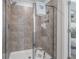 Modern tiled shower with glass door and a spa-like atmosphere at 524 Provence Gate Ln, Lawrenceville, GA 30044