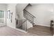 Staircase with railing leading to the upper level; light and airy design, and hardwood floors at 524 Provence Gate Ln, Lawrenceville, GA 30044