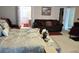 Well-lit bedroom with a comfortable bed and sitting area with an attached bathroom for added convenience at 1074 Deshon Trl, Lithonia, GA 30058