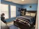 Blue themed bedroom with Spider-Personal decor, carpet, a full size bed, and natural light at 1074 Deshon Trl, Lithonia, GA 30058