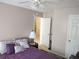Comfortable bedroom featuring a ceiling fan, plush bedding and neutral wall paint at 1074 Deshon Trl, Lithonia, GA 30058