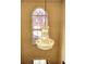 Elegant chandelier lighting up the foyer, complemented by a large window at 1074 Deshon Trl, Lithonia, GA 30058