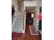 Bright foyer featuring hardwood floors, staircase and views into living area at 1074 Deshon Trl, Lithonia, GA 30058