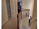 Upstairs hallway featuring beige carpet and light walls at 1074 Deshon Trl, Lithonia, GA 30058