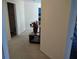 Beige carpeted hallway with beige walls at 1074 Deshon Trl, Lithonia, GA 30058