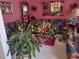 Cozy living room featuring colorful floral couches, pink walls and a grandfather clock at 1074 Deshon Trl, Lithonia, GA 30058