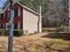 View of the home's exterior and fenced-in backyard, creating a private and secure outdoor space at 1074 Deshon Trl, Lithonia, GA 30058