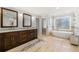 Elegant bathroom with double vanity, soaking tub, granite counters, and marble floors at 2283 Edgemere Lake Cir, Marietta, GA 30062