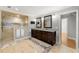 Beautiful bathroom featuring large shower, double sinks, and dark wood cabinets at 2283 Edgemere Lake Cir, Marietta, GA 30062