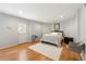 Bright bedroom with wood floors, a white rug, neutral walls and a door to the exterior at 2283 Edgemere Lake Cir, Marietta, GA 30062