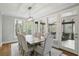 Bright dining room with a screen porch is easily accessible via sliding glass door, and large windows overlooking the backyard at 2283 Edgemere Lake Cir, Marietta, GA 30062