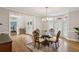 Elegant dining room with hardwood floors, bay window, and classic chandelier at 2283 Edgemere Lake Cir, Marietta, GA 30062