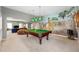 Basement game room with pool table, mural, and open view to living area at 2283 Edgemere Lake Cir, Marietta, GA 30062