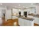 Spacious kitchen showcases stainless steel appliances, a central island, and granite countertops at 2283 Edgemere Lake Cir, Marietta, GA 30062