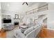 Spacious living room with high ceilings, fireplace, built-ins, and hardwood floors at 2283 Edgemere Lake Cir, Marietta, GA 30062