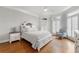 Inviting main bedroom with hardwood floors, shuttered windows, and stylish furnishings at 2283 Edgemere Lake Cir, Marietta, GA 30062