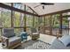 Relax on the screened porch and enjoy the scenic wooded views at 2283 Edgemere Lake Cir, Marietta, GA 30062