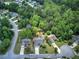 Aerial shot reveals a charming home on a landscaped lot, surrounded by mature trees and a peaceful community at 29 Fern Leaf Ct, Dallas, GA 30157