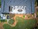 Overhead view of backyard with a deck, pond, landscaping, and grassy lawn at 29 Fern Leaf Ct, Dallas, GA 30157