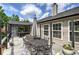 Outdoor back deck with dining set, screened porch, string lights and beautiful backyard at 29 Fern Leaf Ct, Dallas, GA 30157
