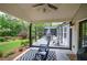 Relaxing backyard with outdoor furniture, a covered patio, a screened porch and beautiful landscaping at 29 Fern Leaf Ct, Dallas, GA 30157