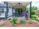 Cozy covered patio with patio furniture, creating an inviting outdoor living area with a grill at 29 Fern Leaf Ct, Dallas, GA 30157