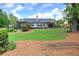 Lovely backyard with a screened-in porch, expansive deck, and a grassy area for outdoor activities at 29 Fern Leaf Ct, Dallas, GA 30157