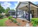 Expansive backyard featuring a deck with patio furniture, a grill, and lush landscaping at 29 Fern Leaf Ct, Dallas, GA 30157