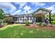 Beautiful backyard with a deck, patio, plush green lawn, and nice landscaping at 29 Fern Leaf Ct, Dallas, GA 30157