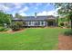 Spacious backyard featuring a screened-in porch, expansive deck, and a grassy area at 29 Fern Leaf Ct, Dallas, GA 30157