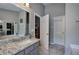 Stylish bathroom with a double sink vanity and walk-in closet at 29 Fern Leaf Ct, Dallas, GA 30157